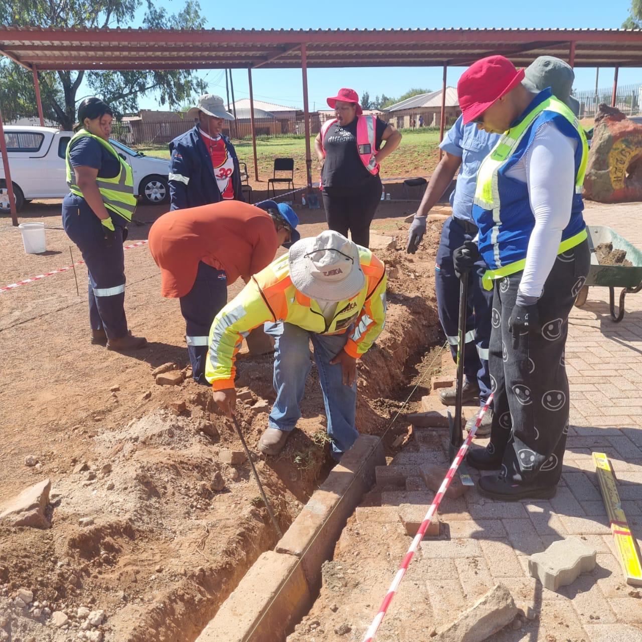 Tshabis construction team preparing groundworks